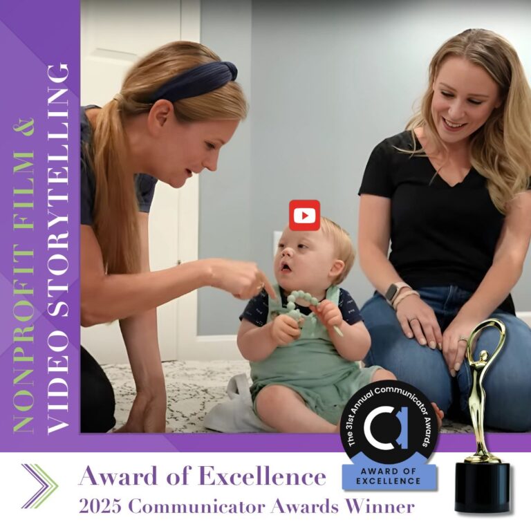 screenshot from a video featuring the Trudeau Center, showing a mother and baby with an occupational therapist