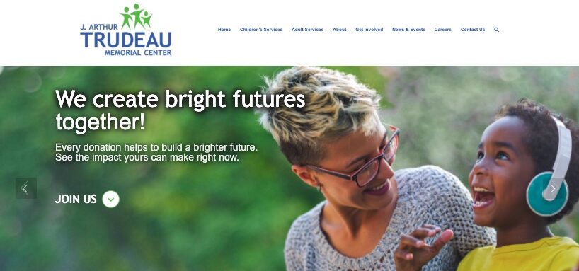 view of the Trudeau Center's website homepage showing text, "Help Support Bright Futures" and a photo of a woman with glasses smiling at a young boy
