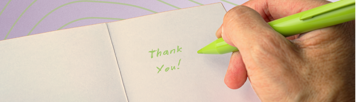 Person writing thank you note