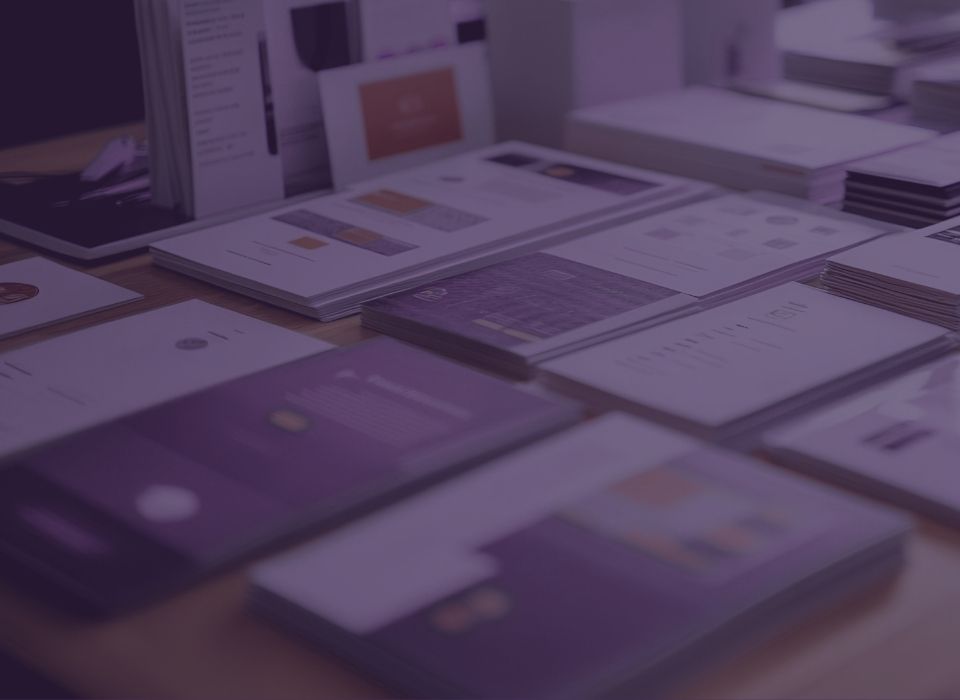 brochures and other branded print collateral laid out on a table